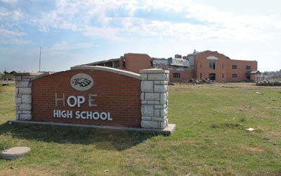 Temporary fixes provide motivation: Joplin residents find ways to stay hopeful, such as the duct tape modification to the former high schools sign. Photo provided by Mary Crane.