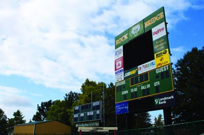 Lighting it up: Kelly Sports Properties raised funds to upgrade the RBHS football field with a new scoreboard, which provides local businesses with new options for advertising. Photo by Muhammad Al-Rawi