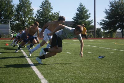 Cut to the chase: At practice, senior captains Matt Kelly and Sam Stoeckl make a turn in a suicide run. The excessive running was a result of not completing 33 out of 100 goals in an earlier drill at the team’s practice.
