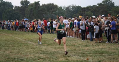 Chasing a dream: Senior Mackenzie Schimpf competes in the Forest Park Invitational. The girls’ team surprised many by winning the meet.
