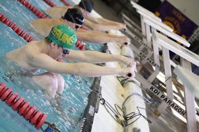 Overflowing ability: Senior Eric Wetz gets ready to go at Hickman swim meet.