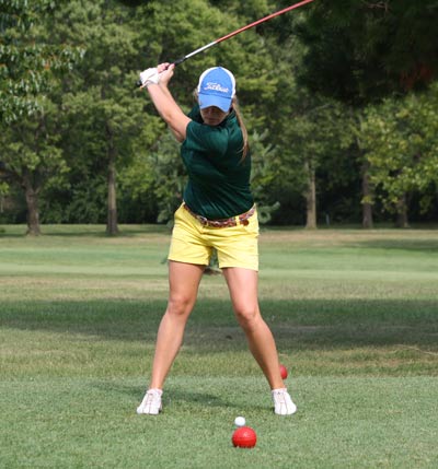 True to the Swing: Senior Morgan Reimler winds back for shot towards the fairway. Photo by Christopher Roberts.