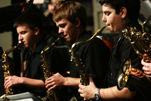 Juniors Ben Bergstorm and Kaleb Jacks and senior Joe Tesoro perform as members of the Jazz Ensemble. These three also play saxophone in the concert bands. Photo by Rena Rong.
