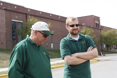Assistant Band Director Bob Thalhuber (right) converses with Band Director Steve Mathews before performing at the Lafayette Marching Band Competition Sept. 24. Today, CPS announced the Thalhuber will be the first Band Director of Battle High School opening for the 2013-2014 school year. Photo courtesy of Shaun Gladney.