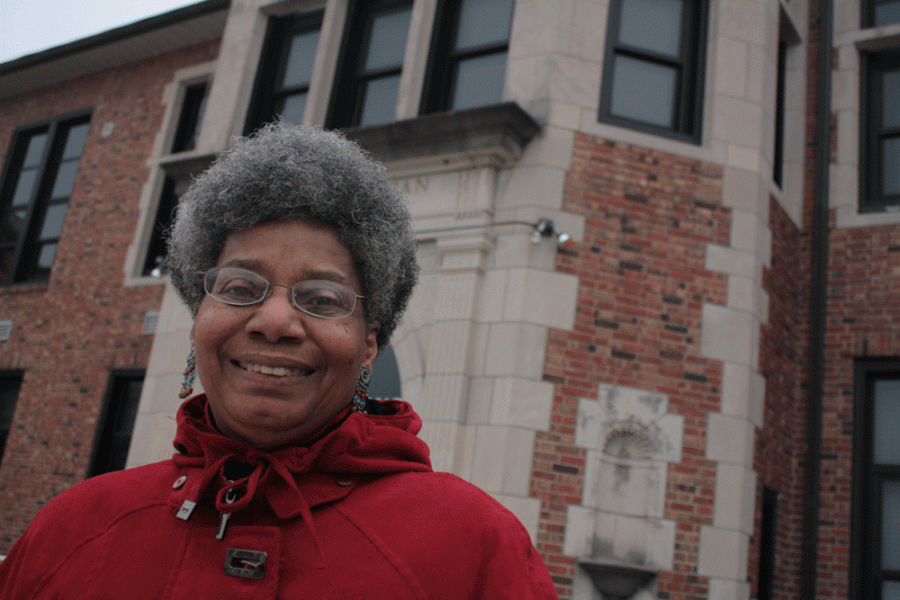 Celestine Hayes stands in front of Hickman High School, which she attended in 1957 as one of the first desegregated students in Columbia. Photo by Asa Lory