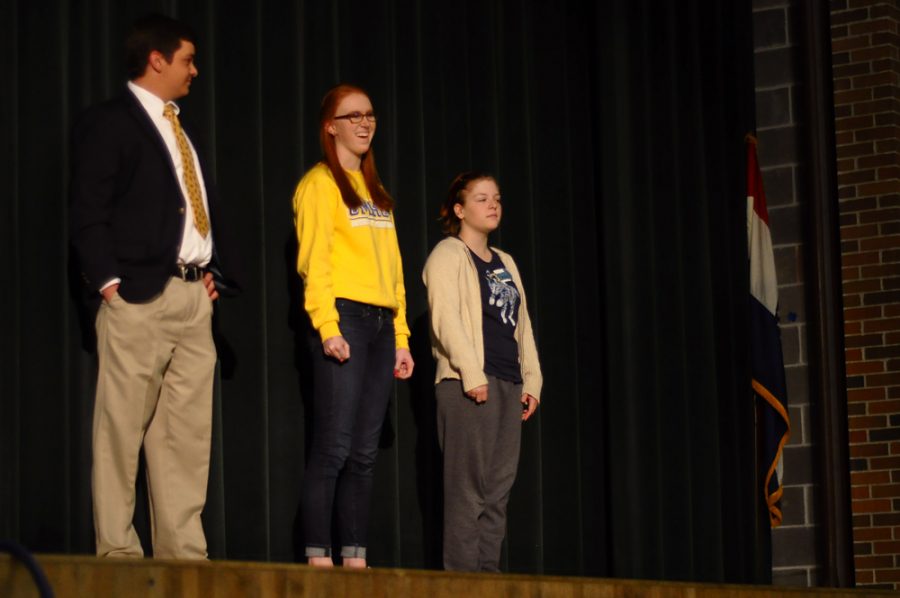 The three candidates for treasurer, juniors Sam Keller (left), Abby Spaedy (middle) and Cameron Grahl stand on stage. Photo by Muhammad Al-Rawi.