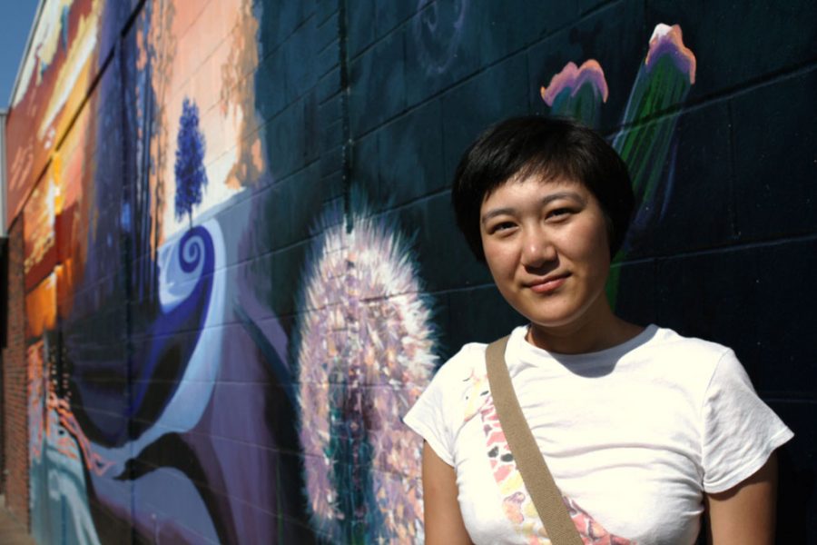Being blown away: RBHS 2012 alumna Rena Rong was one creator of a new mural on the wall of Alpine Shop downtown. Photo by Aniqa Rahman