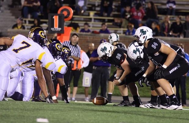 The Bruins and Kewpies face off at the line of scrimmage during last year's Providence Bowl. HHS won the matchup 22-21. Photo by Asa Lory