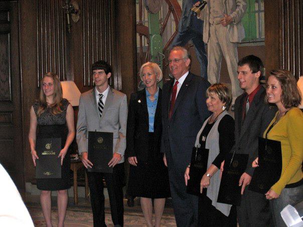 Juniors+Haley+Benson+and+Chandler+Randol+%28left%29+pose+with+Governor+Jay+Nixon%2C+his+wife+Georganne+Wheeler+Nixon+and+other+state+officials+with+the+proclamation.