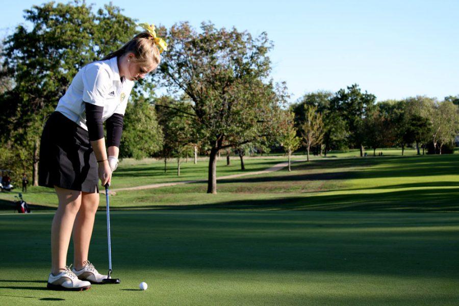 Sophomore Madison McDonnell sets up to putt in a match against Mexico at Lake of the Woods golf course. This was the last match of the season for both the varsity and JV teams. Photo by Aniqa Rahman.