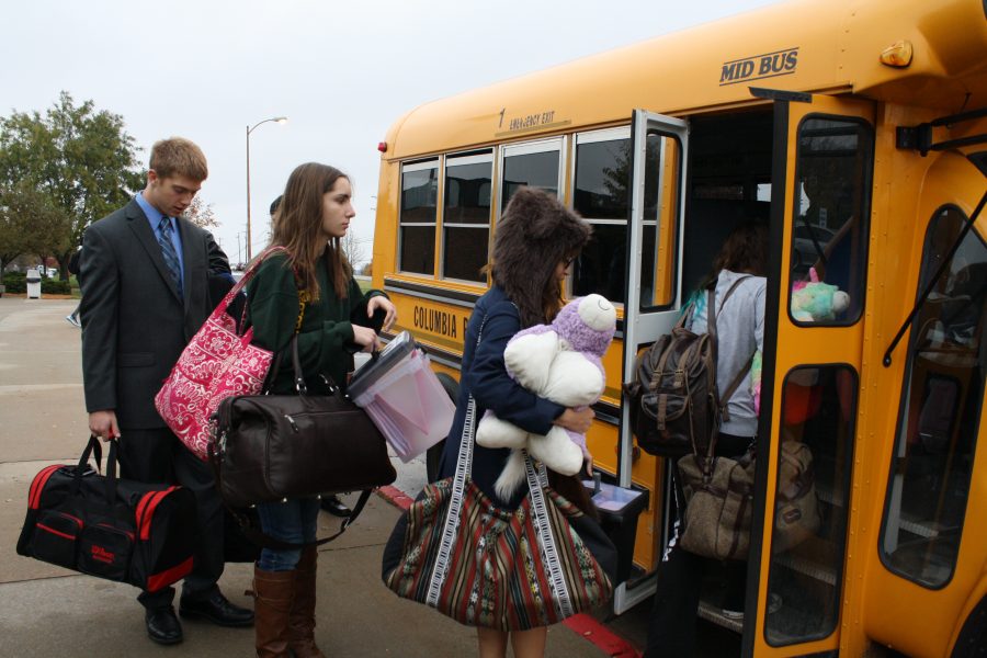 Members of the RBHS debate team pile onto a short bus Friday, Oct. 19, to make the three hour trip to Kansas City for their first tournament of the year. Photo by Aniqa Rahman