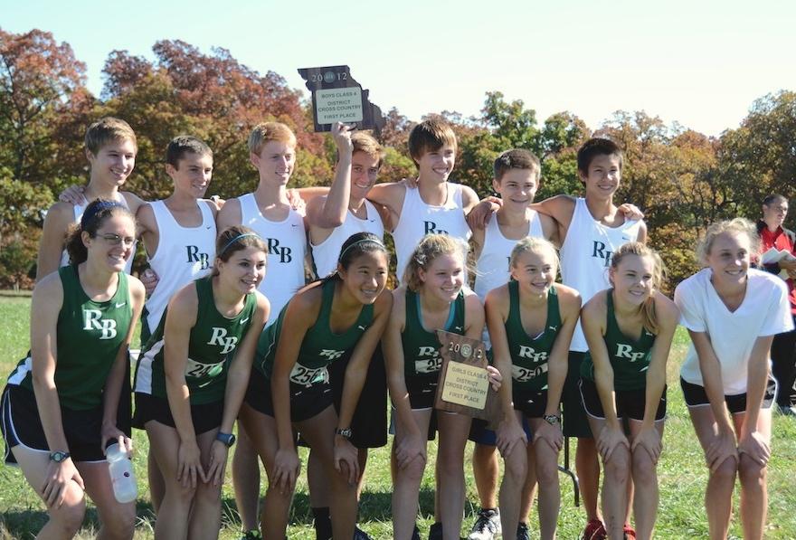 Both boys and girls varsity defended their district titles from last year with strong races from the seniors to freshmen. With the district meet under their belts, they will continue to race hard next Saturday at sectionals, the qualifying meet for state. Photo by Paige Kiehl