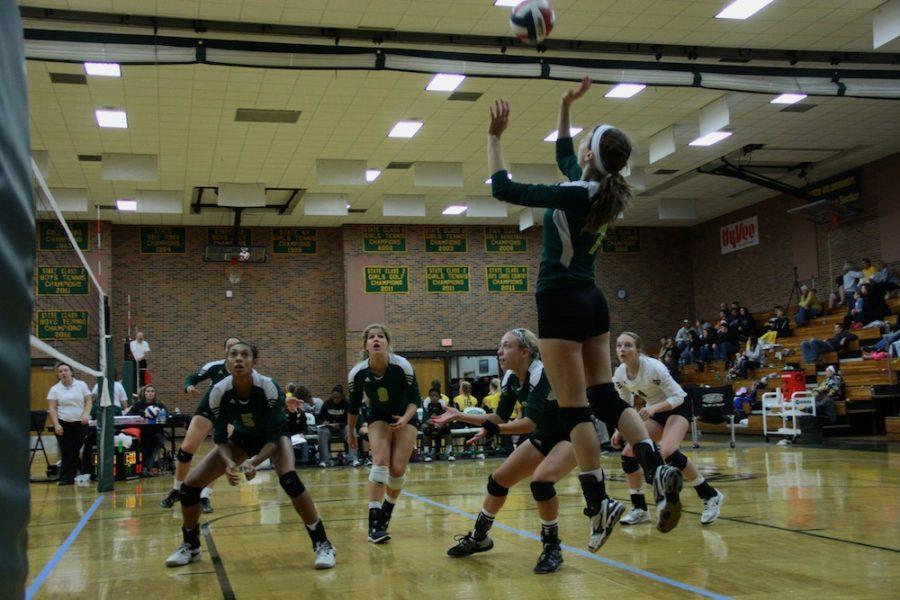 Sophomore Bailey Lawson jumps for a return during last Saturdays tournament at Rock Bridge. Photo by Asa Lory