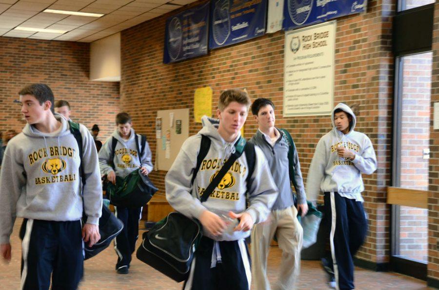 Members of the Boys Basketball team leave school early for a game in Kansas City on Friday. Photo by Paige Kiehl