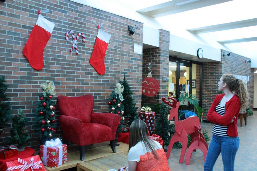 Student volunteers spent Friday afternoon decorating the school in preparation for the Breakfast with Santa event. Photo by Adam Schoelz.