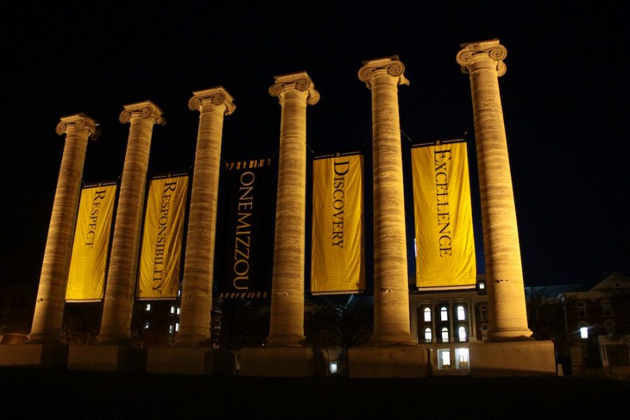 Banners+hang+from+the+columns+on+Francis+Quadrangle.+Photo+by+Asa+Lory