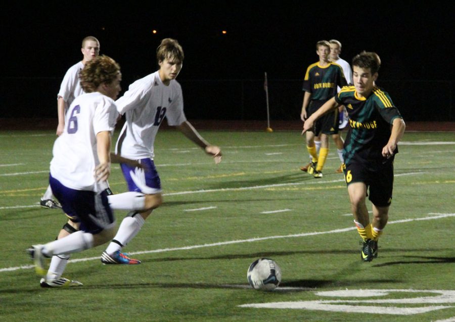 Senior Patrick Bromstedt chases the ball at the Hickman v. Rock Bridge game Sept. 26. Photo by Daphne Yu