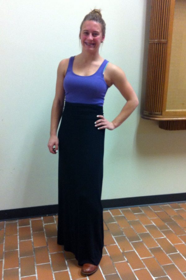 See wears a purple tank top and long black skirt over her brown boots. Photo by Lauren Puckett