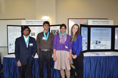 Atreyo Ghosh, Raj Satpathy, Nidhi Khurana and Katelyn Race stand by their poster presentations. Professors from the University of Notre Dame judged the posters hours after the competitors set them up. In the evening, the regional finalists presented their posters to visitors and judges alike. Photo used with permission by Tushar Ghosh