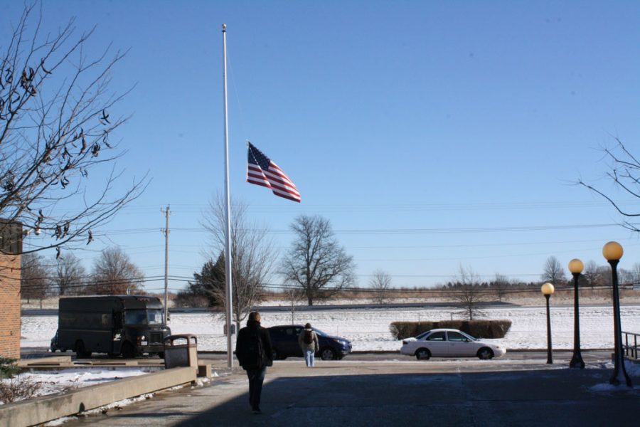 The flag in front of RBHS hangs at half mast Dec. 21. Flags hung at half mast throughout the week to remember those who passed away in the Netwon shootings last Friday. Photo by Daphne Yu