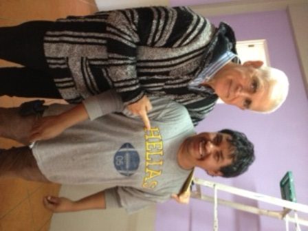 Former teacher and baseball coach Ron Widbin poses with a Guatemalan student wearing a shirt from an RBHS rival: Helias. Widbin is asking RBHS staff and students to donate t-shirts supporting the Bruins to clothe children in Guatemala. Photo provided by Denise McGonigle.