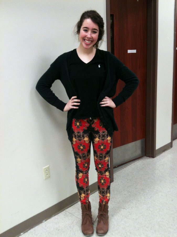 Junior Megan Kelly wears a black sweater with patterned skinny jeans and brown boots. Photo by Lauren Puckett