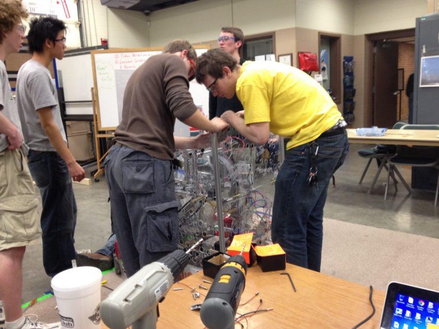 Army Ants members work hard on their second robot.
Photo by John Gillis