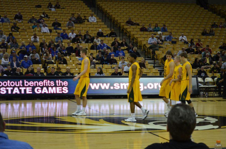 Senior+Alex+Henderson+leads+the+team+as+they+walk+onto+court+at+Mizzou+Arena.+Photo+by+Brittany+Cornelison