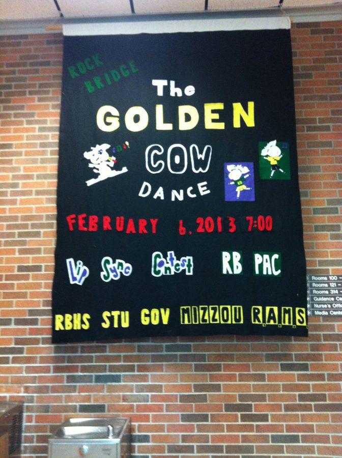 This felt banner advertising the Golden Cow Dance was made back in the 90s, Student Council Golden Cow committee chair, junior Jack Schimpf said. The committee customized it for this years competition.