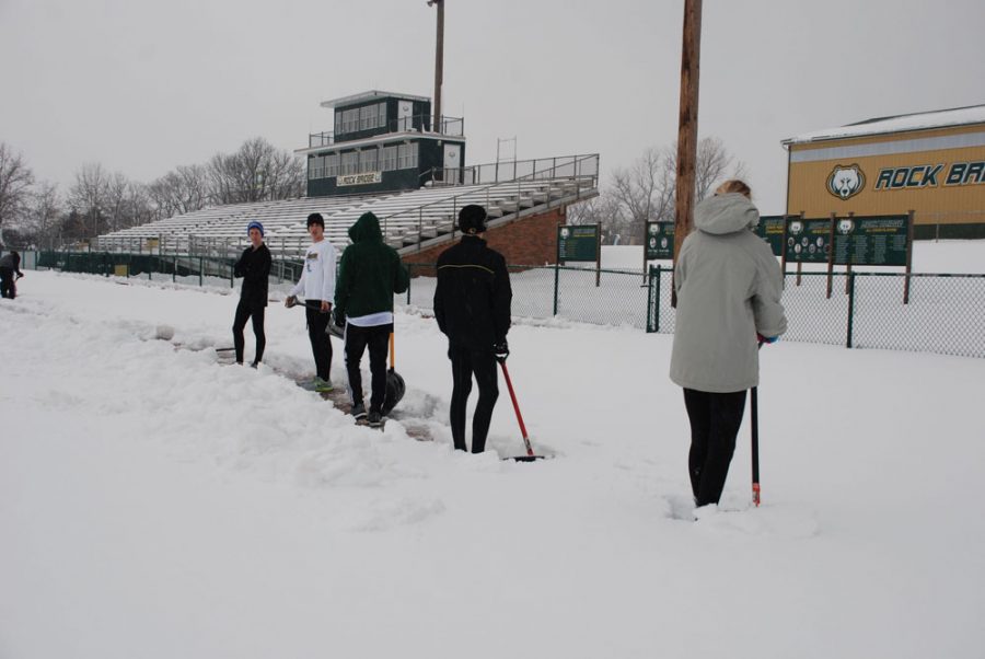 Digging+deep%3A+Members+of+RBHS+track+team+shovel+the+blanket+of+snow+that+covered+the+track+outside+the+school.+Photo+provided+by+Annette+Schulte