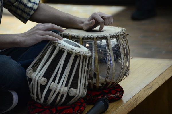 Senior Raj Satpathy plays the Tabla drums ease. Photo by Daphne Yu
