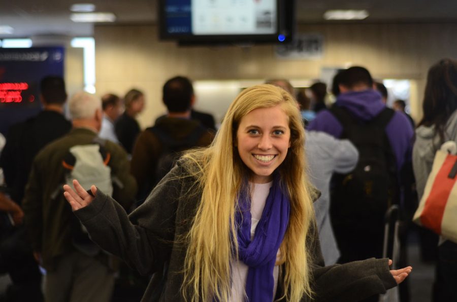 Julia Schaller stands in the Los Angelos Airport, caught in the rush of airport traffic.