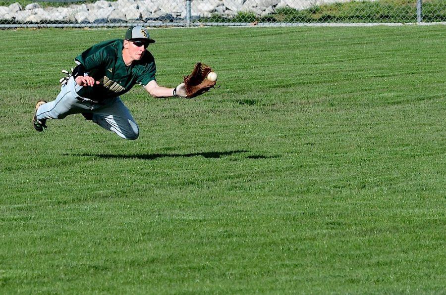 Senior Connor Brumfield dives for a catch.