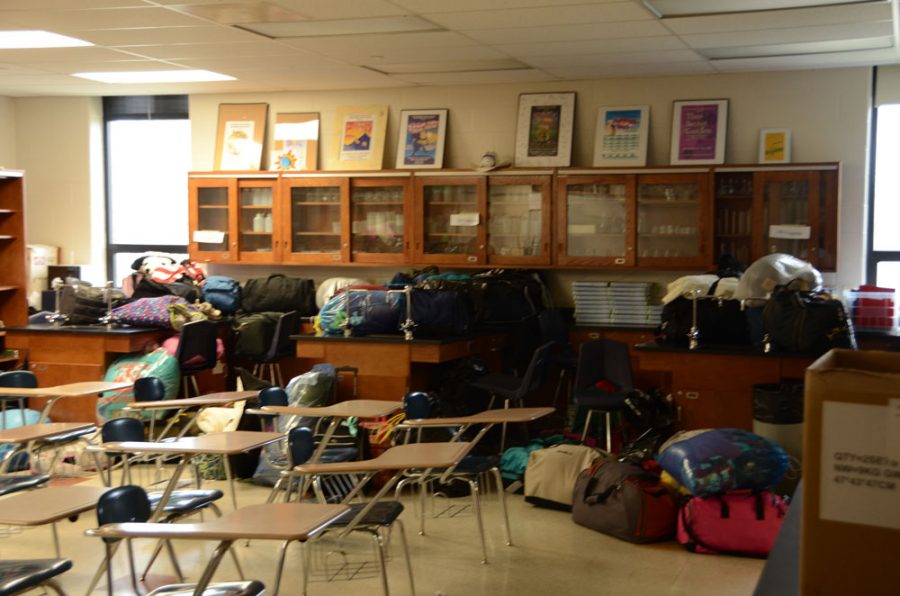 Luggage lines two walls in room 349 as students prepare for a biology field trip. Photo by Renata Williams