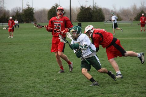 Junior Keegan McGonagle dodges defenders on the offensive side of the field. Photo by Asa Lory