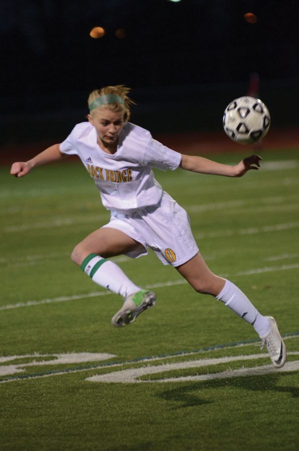 Senior Morgan Bumby passes the ball to a teammate against Helias. Photo by Patrick Smith.