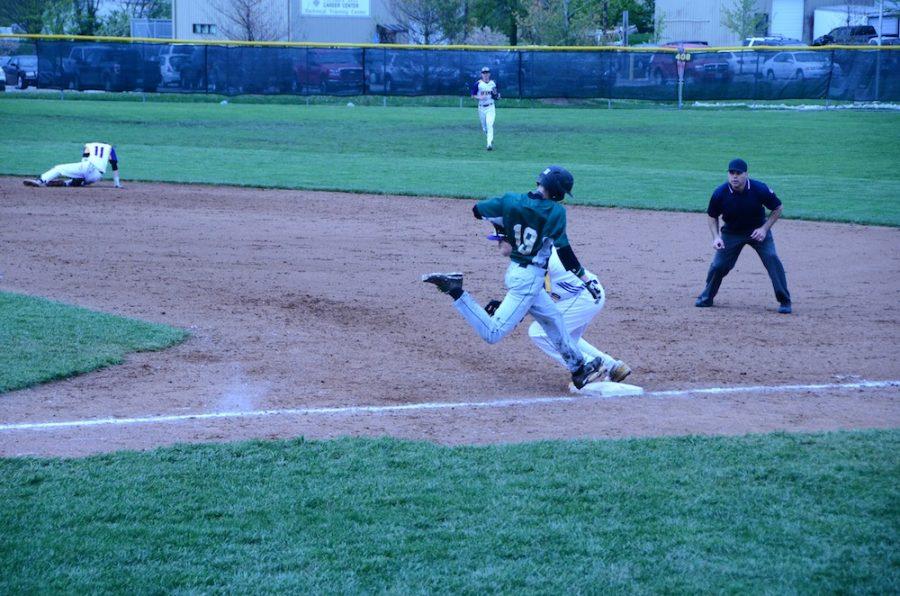 Connor+Brumfield+jumps+onto+first+base+but+Hickman+first+baseman+Jonathan+Jones+gets+the+force+out.+Photo+by+Laurel+Critchfield