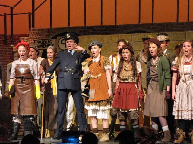Troy Guthrie performs in a scene from Urinetown. 