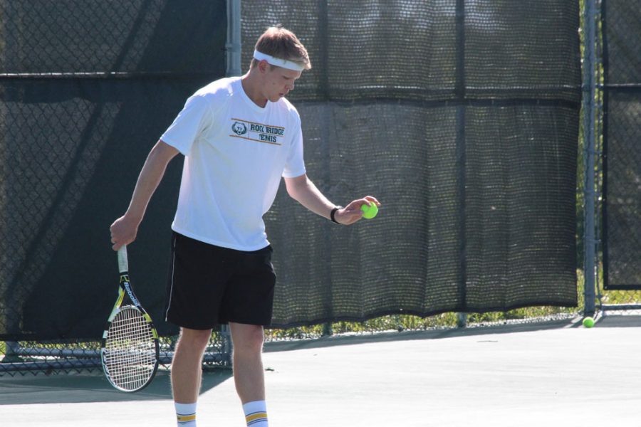 Senior Alex Jones prepares to serve during his doubles match on Monday May 13 against Glendale. Jones and his doubles partner Billy Swift (not pictured) won the match 6-2 and 6-1. Photo by Graham Ratermann.