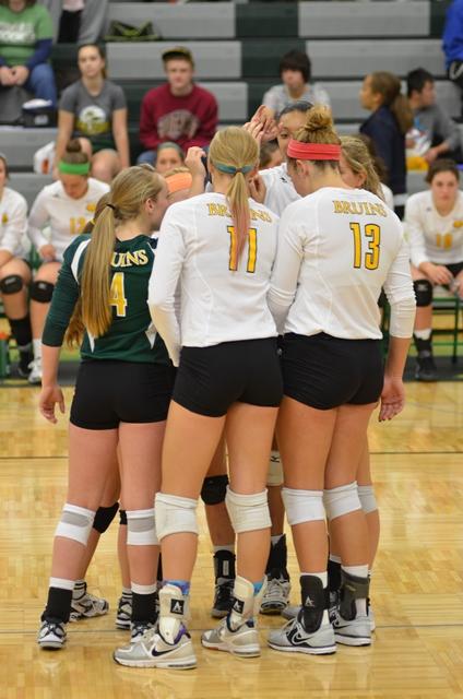 Carly Offerdahl,4, Sophie Cunningham,11, Audrey Holt,13, and their teammates pump themselves up before the start of the game.
Rock Bridge vs. Battle Volleyball Oct. 16, 2013 