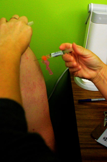 A student receives an influenza vaccine at the Boone County Department of Health and Human Services, on West Worley St. The district does not provide these shots to RBHS students at school. However, the influenza clinics will travel to all elementary and middle schools in the Columbia Public Schools school district.