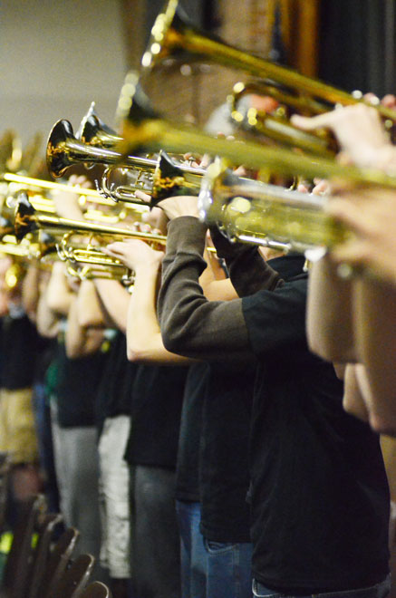 The trumpets perform as part of the Emerald Regiment during the Homecoming assembly