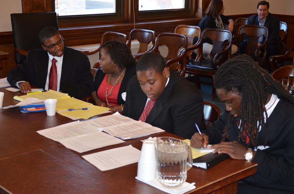 The defense team works on their arguments before the trial begins. Photo by Brittany Cornelison.