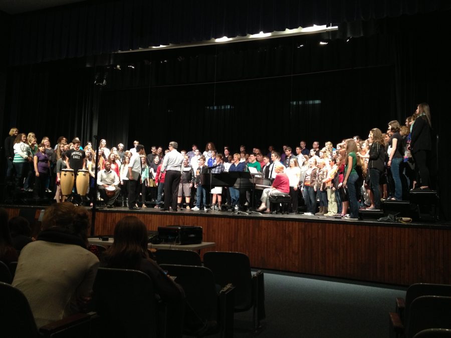 The+Freshman%2FSophomore+District+Choir+rehearses+Tshotsholoza+by+Jeffery+L.+Ames+with+conductor+Mark+Lawley%2C+featuring+RBHS+sophomore+Christian+Henry+and+BHS+choir+director+Jazz+Rucker+on+percussion