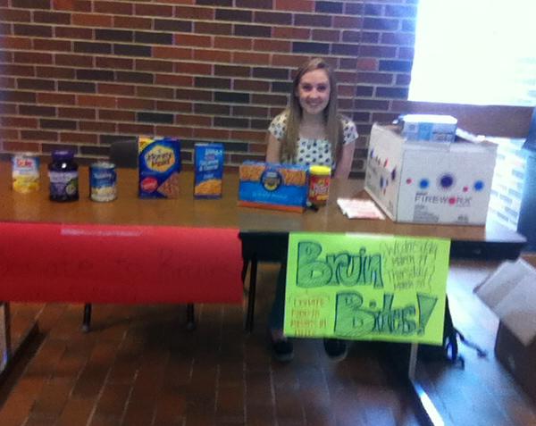 sophomore Rebekah Busick collected food in the main commons on Wednesday for the Bruin Bites food drive. Students are encouraged to donate nonperishables in order to provide for other members of the RBHS community.