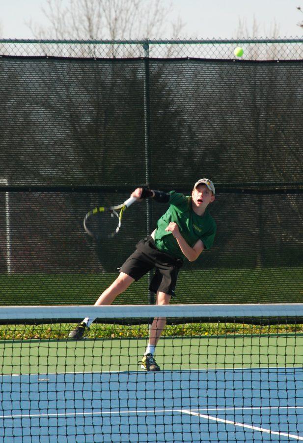 Freshman Brian Baker serves to his competitor from Joplin.
Photo by Pen Terry