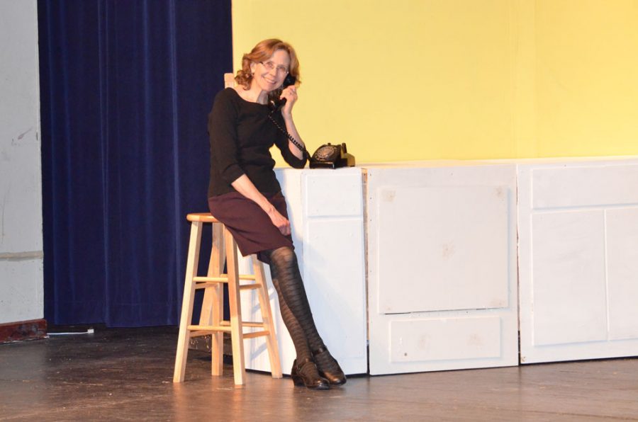 Using one of the sets made in theater tech, Mary Margaret Coffield poses acting like she is on the phone for a skit. Photo by Justin Sutherland