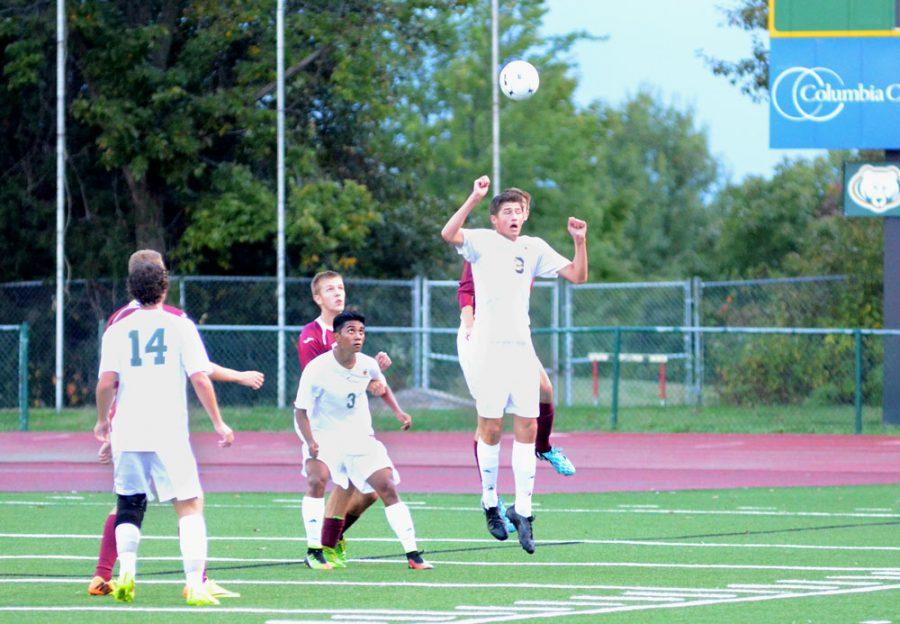 Senior forward Joey Koetting jumps to head a ball while battling a Rolla defender, seniors Julian John and Mitch Stefan look on. Photo by Sury Rawat. 