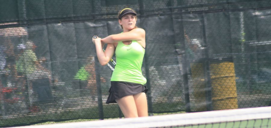 Junior Tess Lovig returns a backhand shot during the Great 8 Tournament. The Bruins went on to defeat both Visitation Academy and Barstow that day. Photo by Bailey Washer