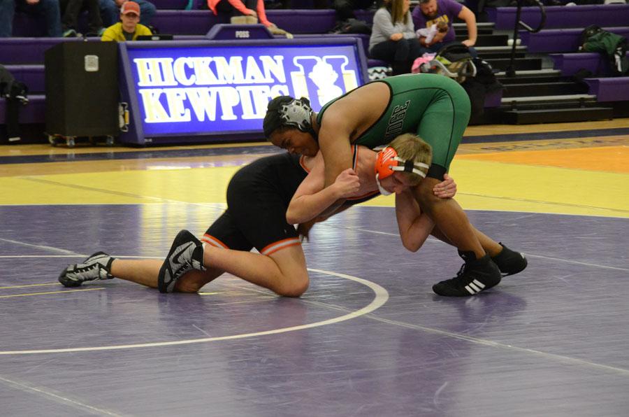 Freshman Don Hammers sprawls on his Kirksville opponent in a match at 195 pounds. Photo by Abby Blitz. 